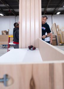 Kundig team members working on custom woodworking project